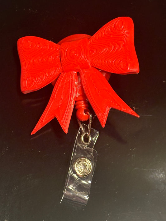 3d red bow badge reel
